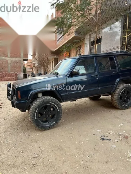 جيب شيروكي 1999 أزرق غامق مستعملة للبيع - 6