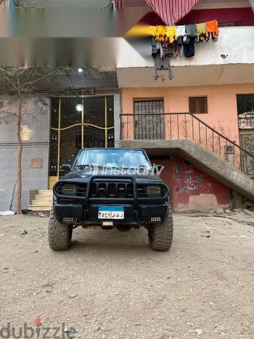 جيب شيروكي 1999 أزرق غامق مستعملة للبيع - 7