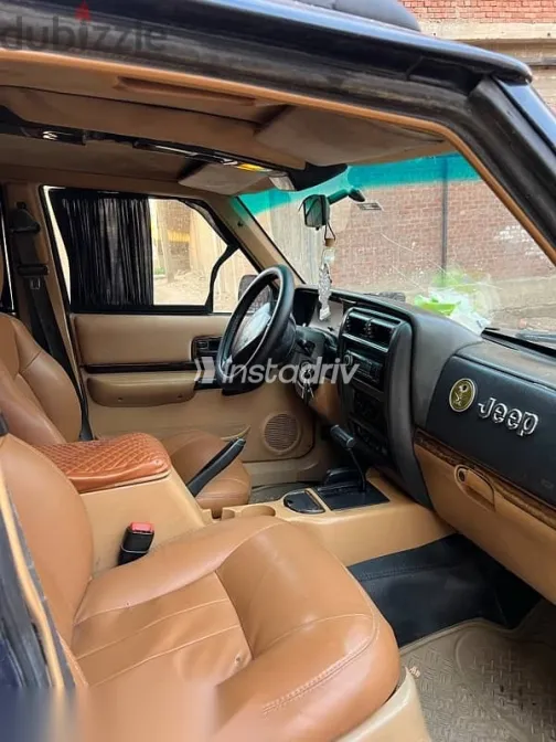 جيب شيروكي 1999 أزرق غامق مستعملة للبيع - 9