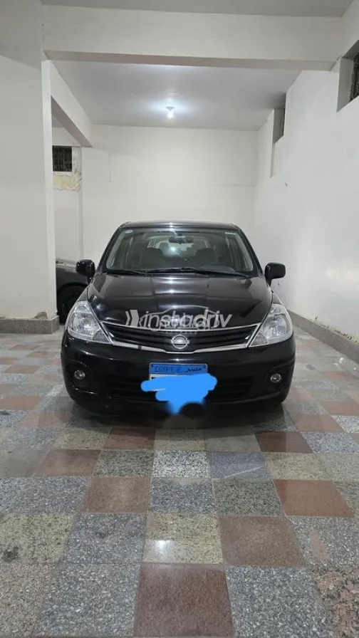 نيسان تيدا 2012 أسود مستعملة للبيع - 1