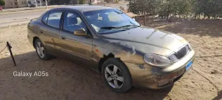 دايو ليوجانزا 1999 ذهبي مستعملة للبيع
