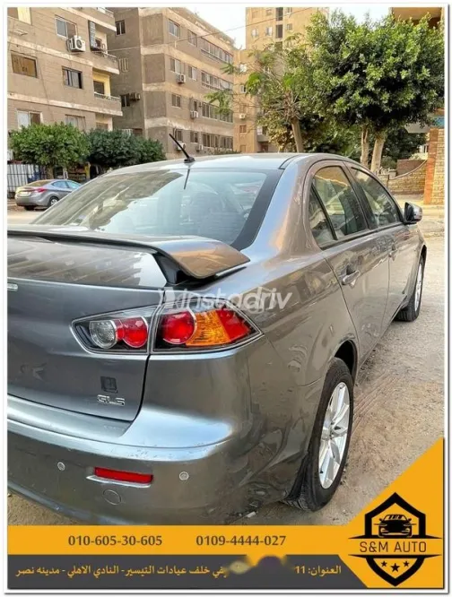 ميتسوبيشي لانسر 2015 فضي مستعملة للبيع - 4