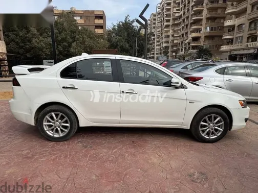 ميتسوبيشي لانسر 2015 أبيض مستعملة للبيع - 4