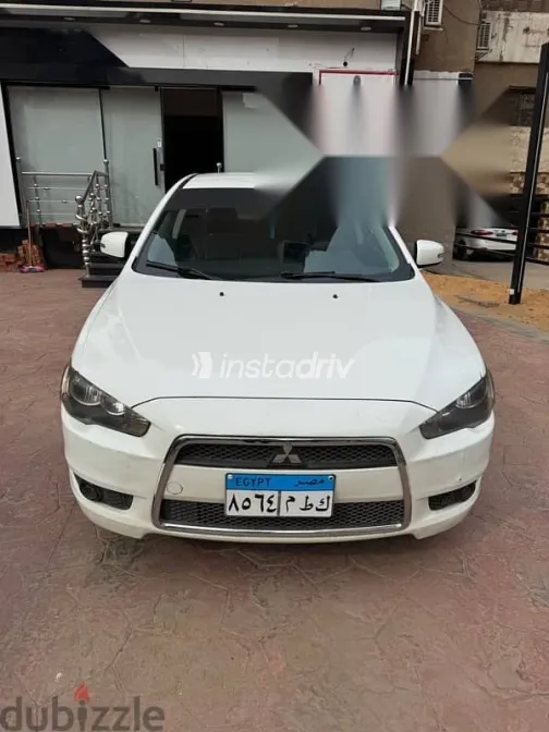 ميتسوبيشي لانسر 2015 أبيض مستعملة للبيع - 6