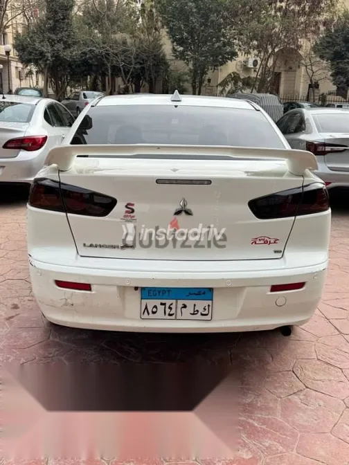 ميتسوبيشي لانسر 2015 أبيض مستعملة للبيع - 7