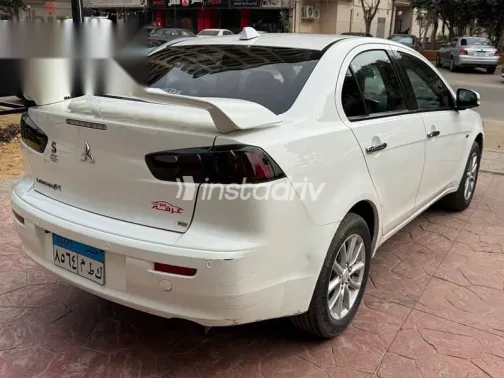 ميتسوبيشي لانسر 2015 أبيض مستعملة للبيع - 9