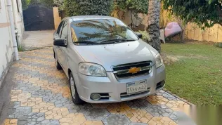 شيفروليه افيو 2013 فضي مستعملة للبيع