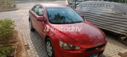 ميتسوبيشي لانسر 2014 أبيض مستعملة للبيع - 1