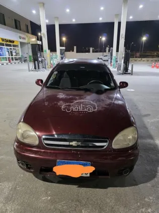 شيفروليه لانوس 2014 أحمر غامق مستعملة للبيع