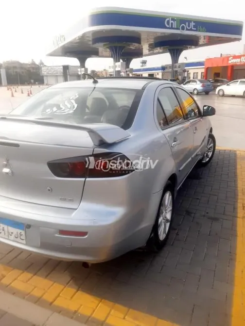 ميتسوبيشي لانسر اى اكس شارك 2015 فضي مستعملة للبيع - 2