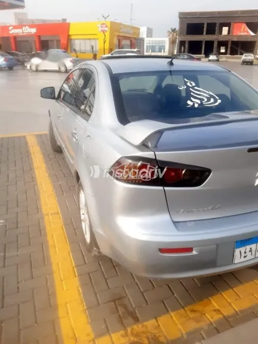 ميتسوبيشي لانسر اى اكس شارك 2015 فضي مستعملة للبيع - 5