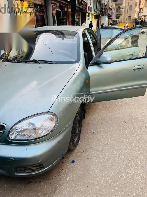 دايو لانوس 2005 أبيض مستعملة للبيع - 7