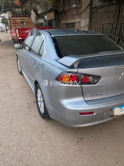 ميتسوبيشي لانسر 2015 فضي مستعملة للبيع - 1