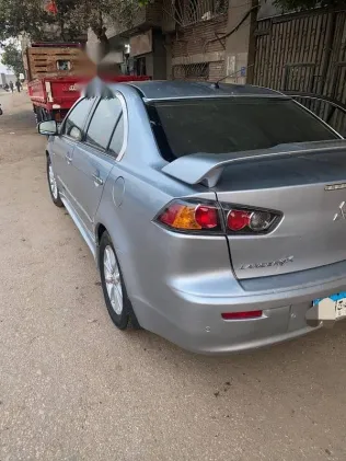 ميتسوبيشي لانسر 2015 فضي مستعملة للبيع