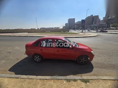 اوبل كورسا 2003 أحمر مستعملة للبيع - 6