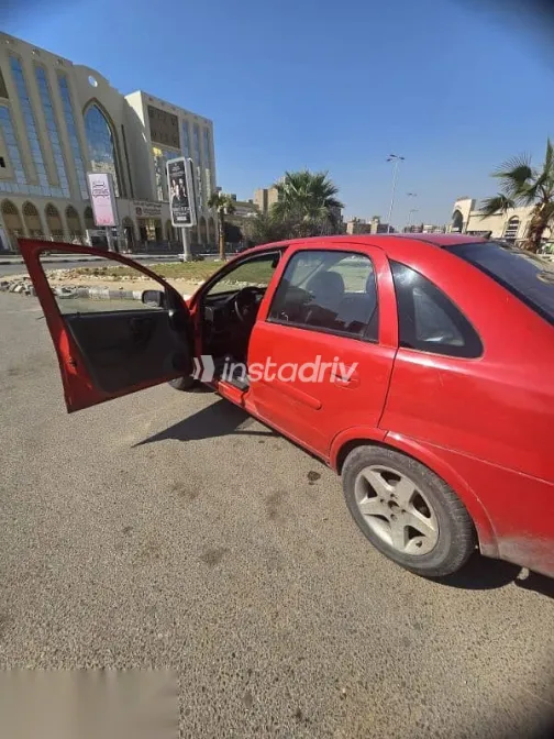 اوبل كورسا 2003 أحمر مستعملة للبيع - 9