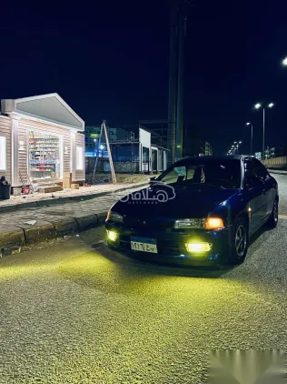 ميتسوبيشي لانسر 1998 أزرق غامق مستعملة للبيع
