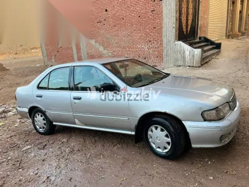 نيسان صنى 1999 فضي مستعملة للبيع - 2