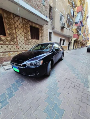 ميتسوبيشي لانسر اى اكس شارك 2015 أبيض مستعملة للبيع