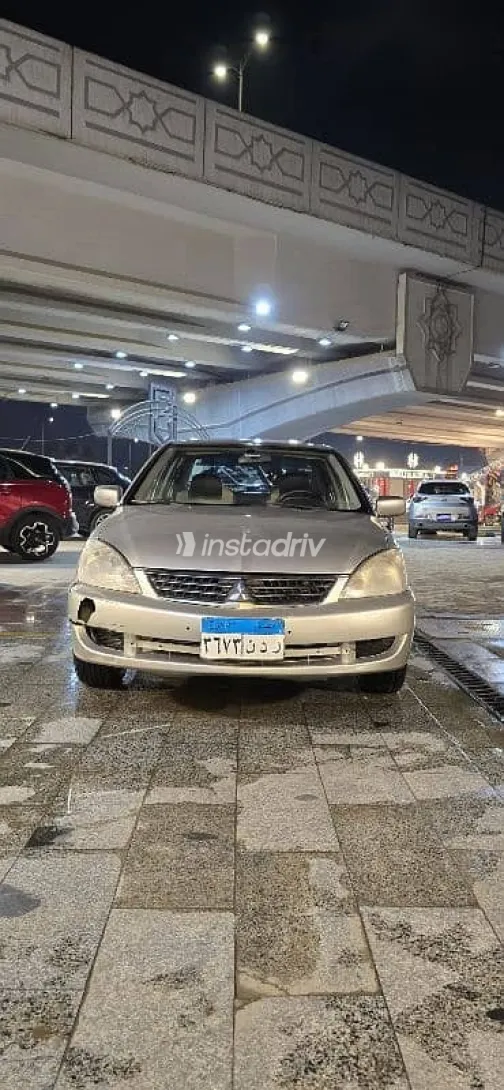 ميتسوبيشي لانسر 2012 ذهبي مستعملة للبيع - 1