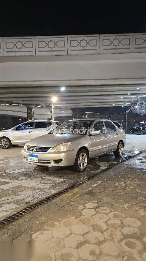 ميتسوبيشي لانسر 2012 ذهبي مستعملة للبيع - 2