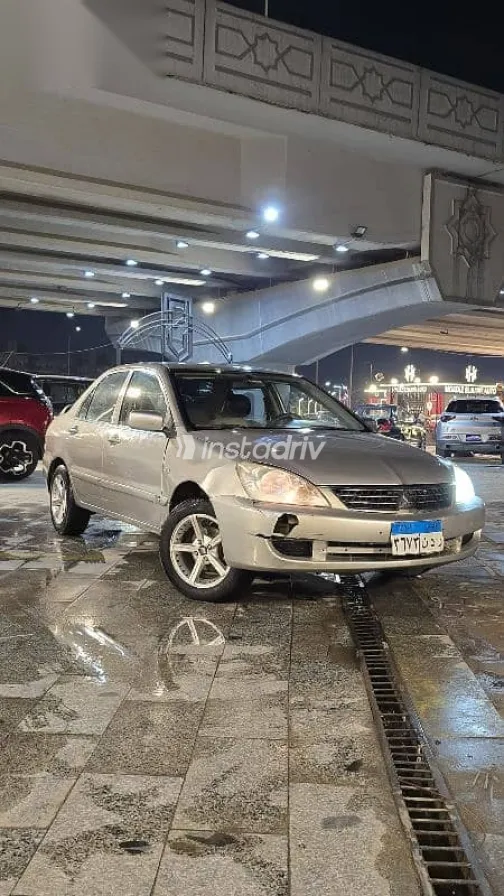 ميتسوبيشي لانسر 2012 ذهبي مستعملة للبيع - 5