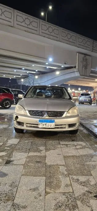 ميتسوبيشي لانسر 2012 ذهبي مستعملة للبيع