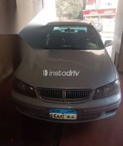 نيسان صنى 2002 فضي مستعملة للبيع - 1