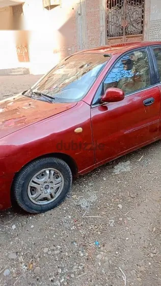 دايو لانوس 1999 أحمر مستعملة للبيع