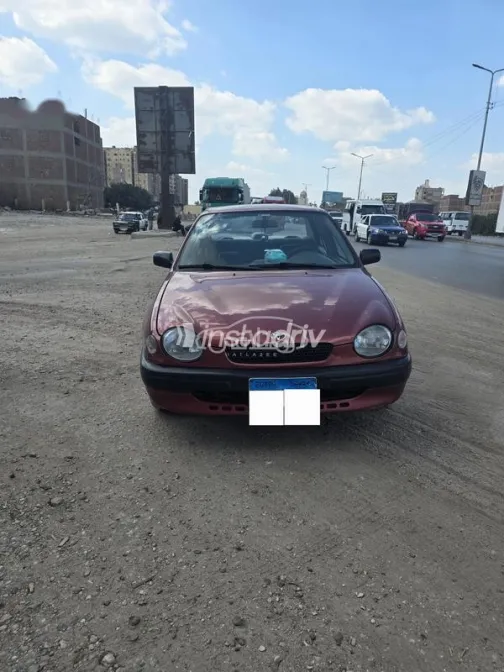 تويوتا كورولا 1999 أحمر غامق مستعملة للبيع - 1