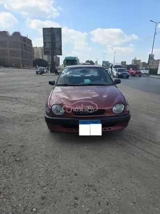 تويوتا كورولا 1999 أحمر غامق مستعملة للبيع