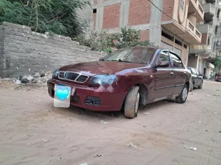 شيفروليه لانوس 2012 أحمر غامق مستعملة للبيع