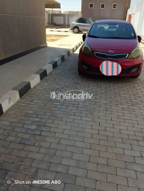 كيا ريو 2013 أحمر مستعملة للبيع - 2