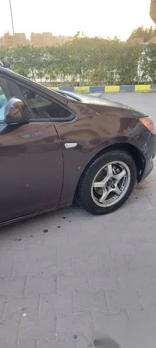 اوبل أسترا 2013 بني مستعملة للبيع