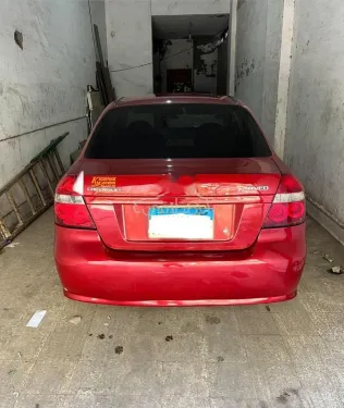 شيفروليه افيو 2013 أحمر غامق مستعملة للبيع