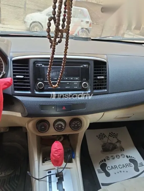 ميتسوبيشي لانسر 2016 أحمر مستعملة للبيع - 7