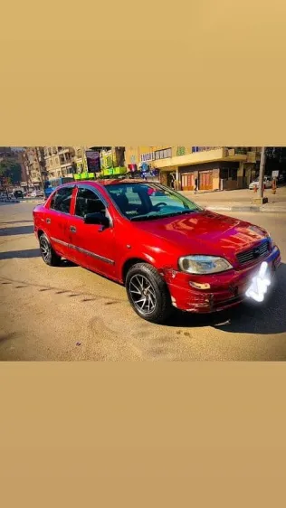 اوبل أسترا 2000 أحمر مستعملة للبيع