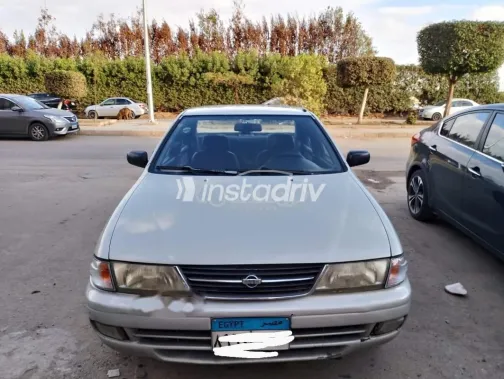 نيسان صنى 1997 فضي مستعملة للبيع - 1