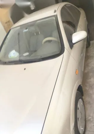 نيسان صنى 2005 ذهبي مستعملة للبيع