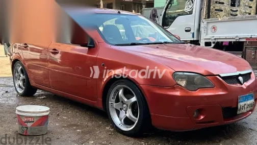 بروتون جين 2 2008 برتقالي مستعملة للبيع - 5