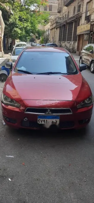 ميتسوبيشي لانسر اى اكس شارك 2016 أحمر مستعملة للبيع