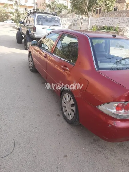 ميتسوبيشي لانسر بومة 2008 أحمر غامق مستعملة للبيع - 4