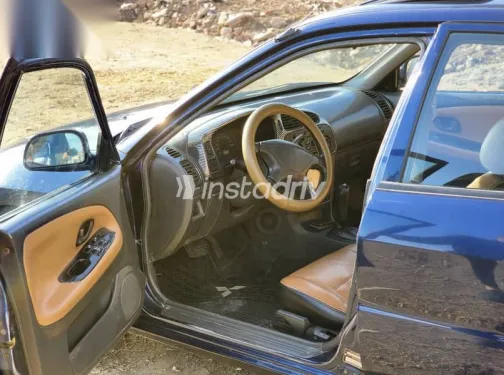 ميتسوبيشي لانسر 1999 أزرق غامق مستعملة للبيع - 3