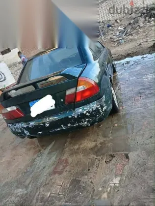 ميتسوبيشي لانسر 1999 أخضر مستعملة للبيع