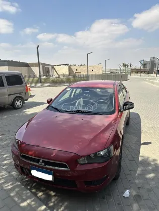 ميتسوبيشي لانسر اى اكس شارك 2016 أحمر مستعملة للبيع
