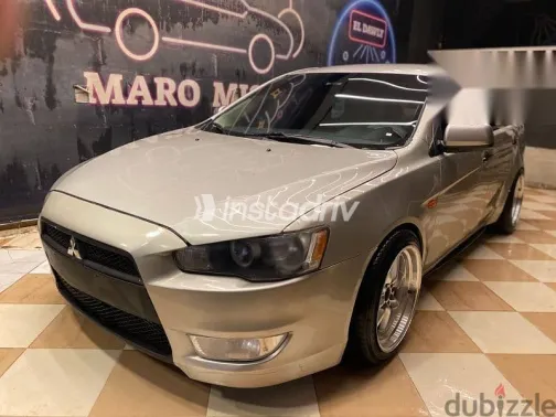 ميتسوبيشي لانسر 2015 فضي مستعملة للبيع - 2