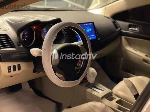 ميتسوبيشي لانسر 2015 فضي مستعملة للبيع - 9