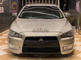 ميتسوبيشي لانسر 2015 فضي مستعملة للبيع
