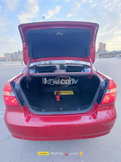 شيفروليه افيو 2014 أحمر غامق مستعملة للبيع - 3