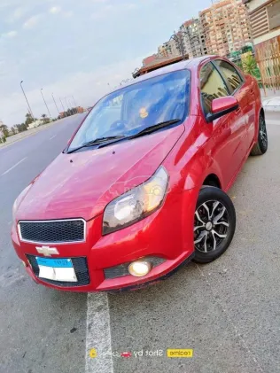 شيفروليه افيو 2014 أحمر غامق مستعملة للبيع
